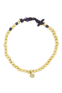 Zusss armband met donkerblauwe glassteentjes en goudkleurige kralen