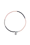 Zusss armband bestaande uit roze kralen en metalen zilverkleurige accenten