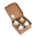 Set van vier handgemaakte Cotton-maché ballen in wit met gouden details