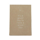 Een notitieblok van het merk Leeff in naturel kraftpapier met de tekst It's a good day to have a good day op de voorzijde.