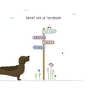 Wenskaart Frits tussenjaar met een illustratie van een teckel bij een wegwijzer
