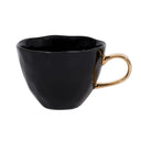 Zwarte porseleinen mok van Urban Nature Culture met een goudkleurig oor uit de Good Morning serie