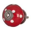 Rode bolknop met witte stippen
