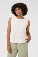 Cream top paillet in offwhite kleur met ronde hals