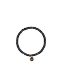 Zwarte Barts armband lumnian met goudkleurige kraaltjes en een Barts logo bedeltje.