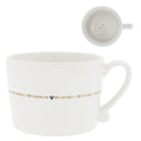 Bastion Collections mok l line hearts in wit aardewerk met een caramelkleurige rand en hartjesmotief