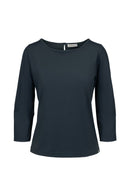 Zusss travel top in de kleur grijs met smalle mouwen en een metalen logo muntje aan de onderzijde.