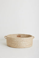 Ronde, handgeweven vloermand Joti van naturelkleurig jute met een diameter van 50 cm.
